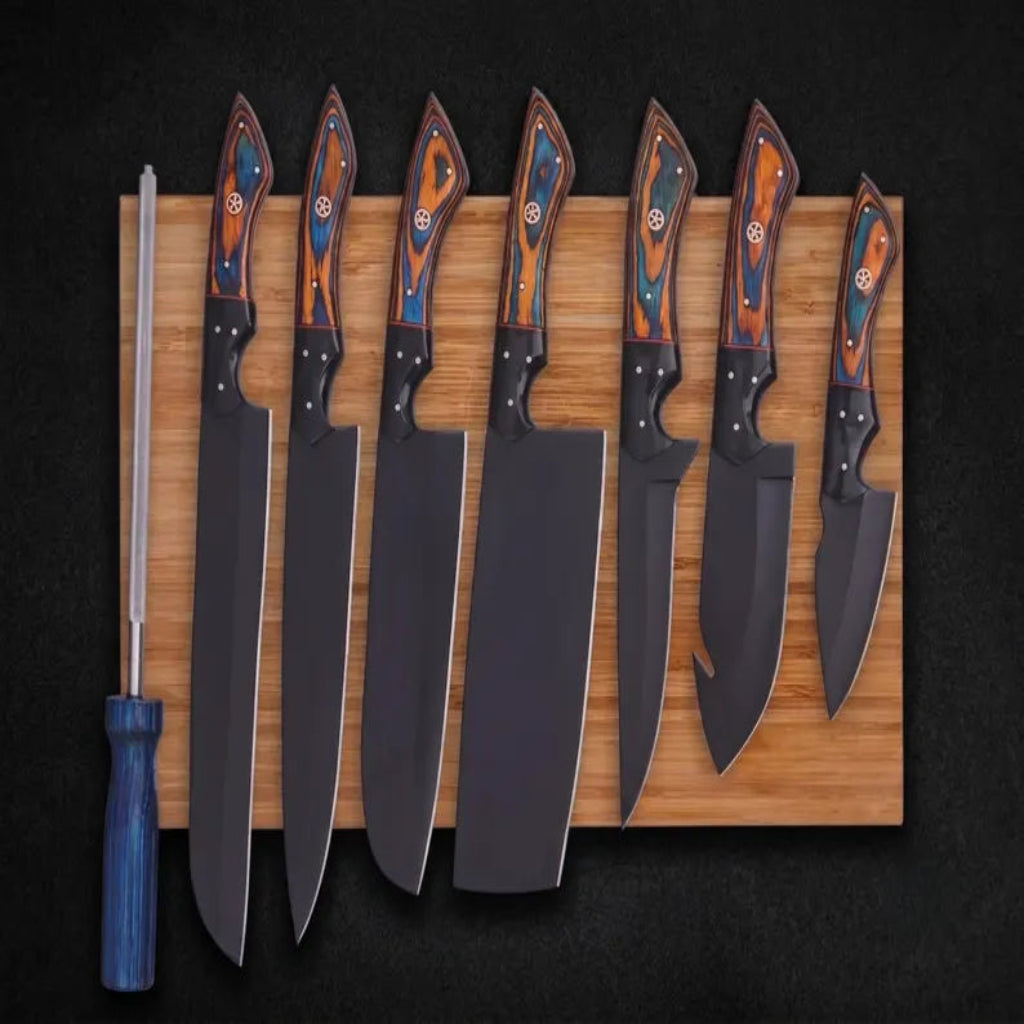 Seven fixed-blade knives with dark steel blades and colorful wood-pattern handles are arranged on a rectangular wooden board, with a sharpening steel standing to the left, all photographed against a dark background.